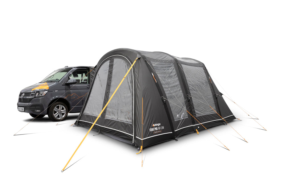 Grey Vango Cove Pro Air Low driveaway awning attached to a campervan, with front canopy panels, large windows and guy lines visible.