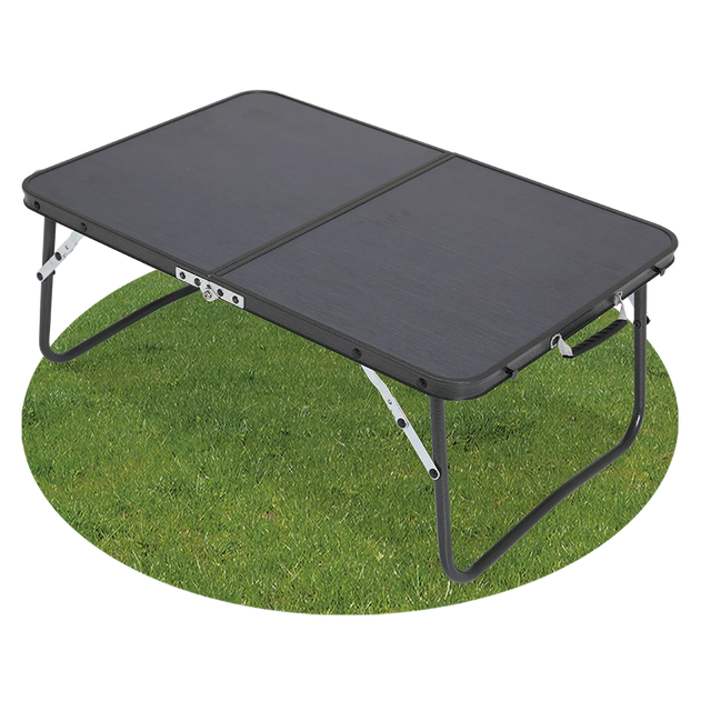 Quest Superlite Witney low folding camping table with black tabletop and legs extended on grass